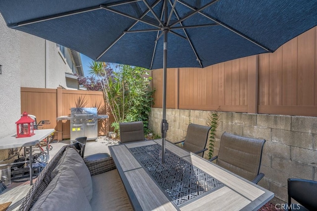 13421 Hubbard St Unit 119, Sylmar, CA 91342 - view of patio / terrace featuring outdoor dining area and area for grilling