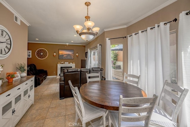13421 Hubbard St Unit 119, Sylmar, CA 91342 - dining area featuring a chandelier, ornamental molding, and recessed lighting