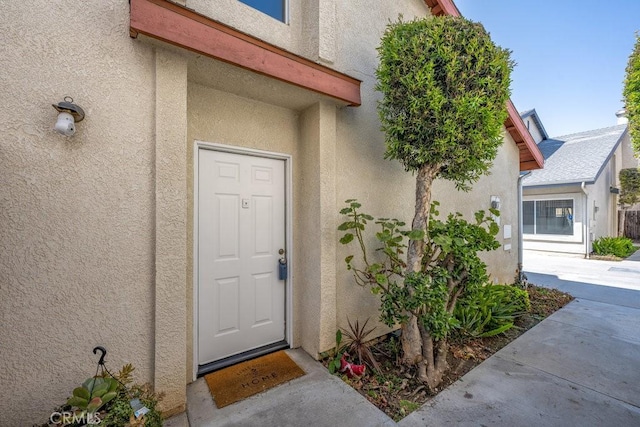 13421 Hubbard St Unit 119, Sylmar, CA 91342 - view of exterior entry with stucco siding