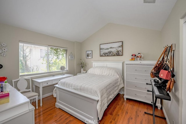 13421 Hubbard St Unit 119, Sylmar, CA 91342 - bedroom featuring lofted ceiling and wood finished floors