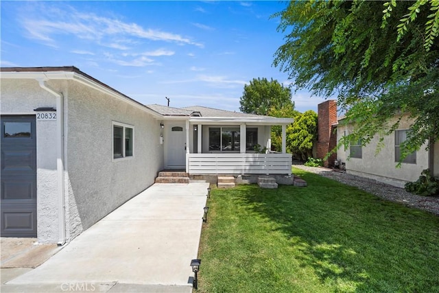 20832 Halldale Ave, Torrance, CA 90501 - view of exterior entry with a lawn and stucco siding