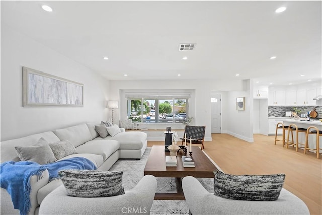 20832 Halldale Ave, Torrance, CA 90501 - living room featuring recessed lighting and light wood-style floors