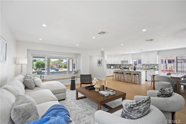20832 Halldale Ave, Torrance, CA 90501 - living room featuring recessed lighting, healthy amount of natural light, and light wood-type flooring