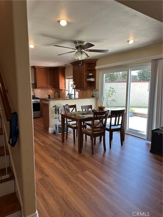 2690 Peralta Ct, Tustin, CA 92782 - dining space with dark wood-type flooring, ceiling fan, and a textured ceiling