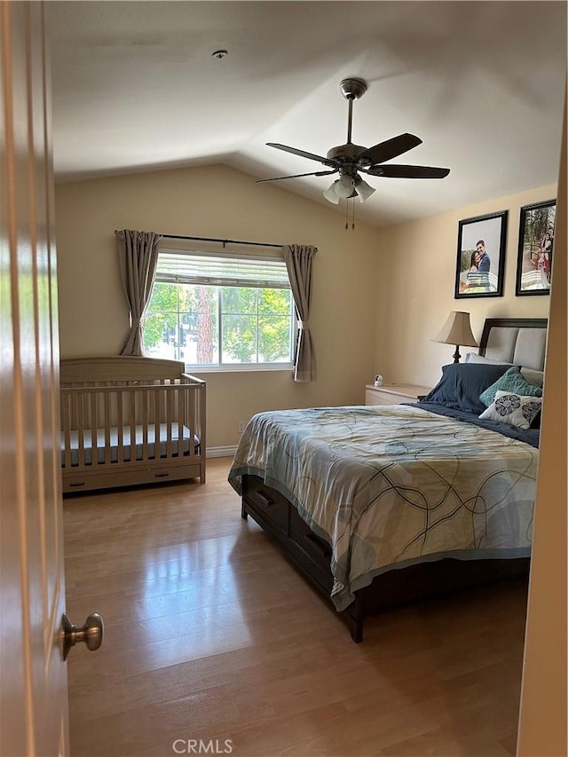 2690 Peralta Ct, Tustin, CA 92782 - bedroom with wood finished floors, vaulted ceiling, and ceiling fan