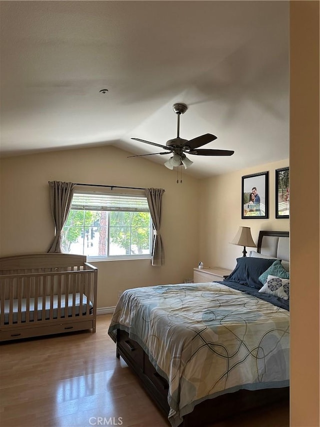 2690 Peralta Ct, Tustin, CA 92782 - bedroom featuring wood finished floors, lofted ceiling, and a ceiling fan