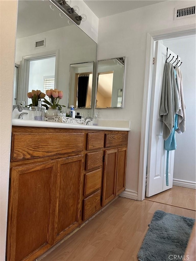2690 Peralta Ct, Tustin, CA 92782 - bathroom featuring double vanity and wood finished floors