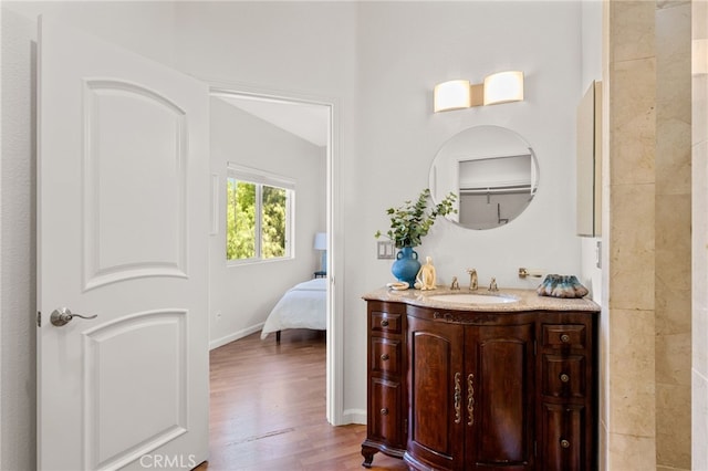 210 N Stage Coach Ln, Fallbrook, CA 92028 - ensuite bathroom featuring vanity and wood finished floors