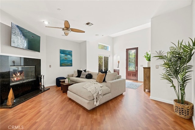 210 N Stage Coach Ln, Fallbrook, CA 92028 - living room featuring a high end fireplace, wood finished floors, and ceiling fan