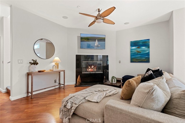 210 N Stage Coach Ln, Fallbrook, CA 92028 - bedroom with wood finished floors, a fireplace, and ceiling fan