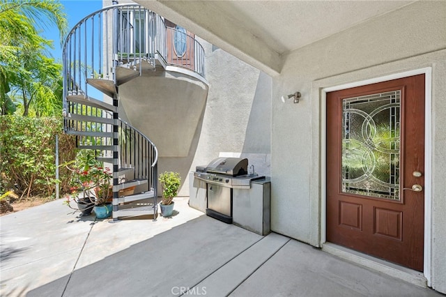 210 N Stage Coach Ln, Fallbrook, CA 92028 - view of exterior entry featuring a patio and stucco siding