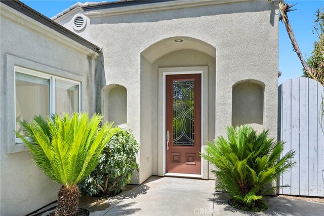 210 N Stage Coach Ln, Fallbrook, CA 92028 - property entrance with stucco siding and a gate