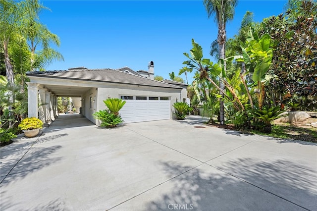 210 N Stage Coach Ln, Fallbrook, CA 92028 - view of front facade featuring concrete driveway, stucco siding, a tile roof, and a chimney