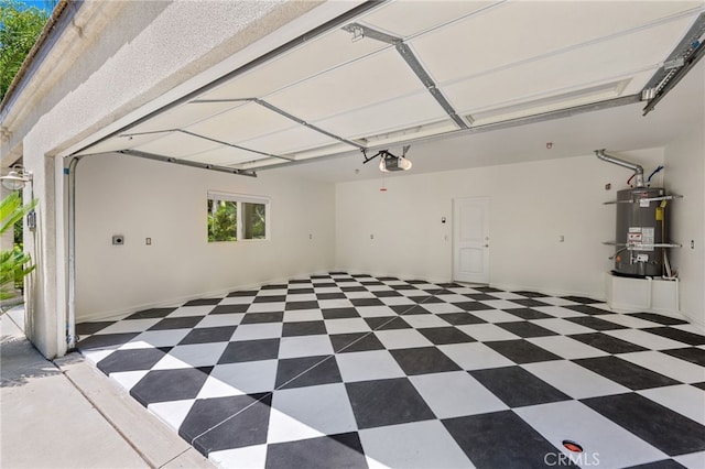 210 N Stage Coach Ln, Fallbrook, CA 92028 - garage featuring strapped water heater and a garage door opener