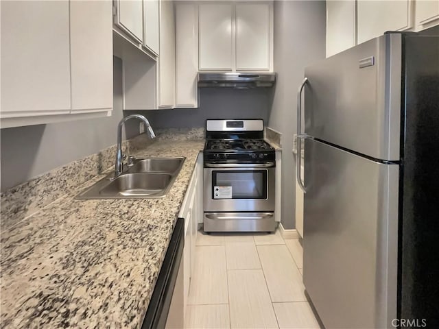 14560 Clark St Unit 202, Sherman Oaks, CA 91411 - kitchen with appliances with stainless steel finishes, under cabinet range hood, white cabinetry, and light tile patterned floors