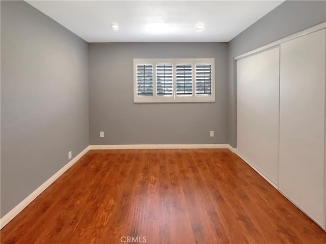 14560 Clark St Unit 202, Sherman Oaks, CA 91411 - unfurnished bedroom with wood finished floors, a closet, and recessed lighting
