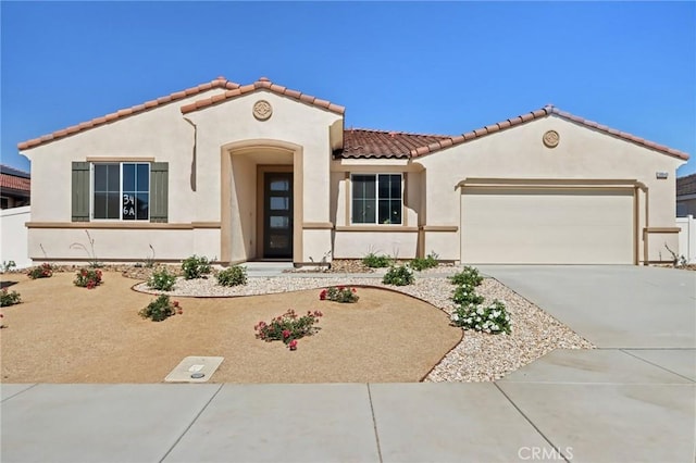 38840 Malva Rosa Dr, Palmdale, CA 93551 - mediterranean / spanish house featuring a garage, stucco siding, driveway, and a tiled roof