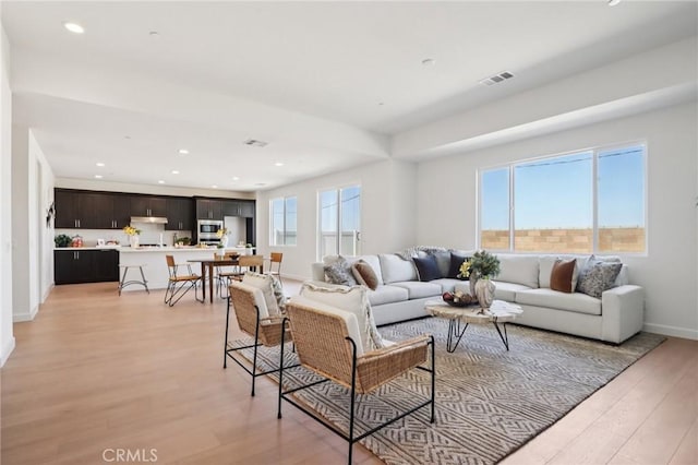 38840 Malva Rosa Dr, Palmdale, CA 93551 - living area featuring light wood finished floors and recessed lighting