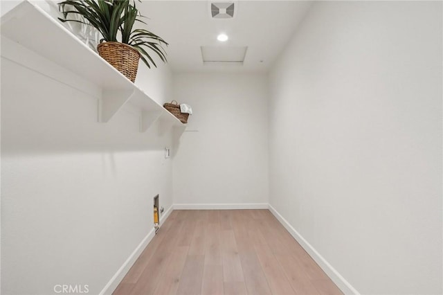 38840 Malva Rosa Dr, Palmdale, CA 93551 - walk in closet with attic access and light wood-type flooring
