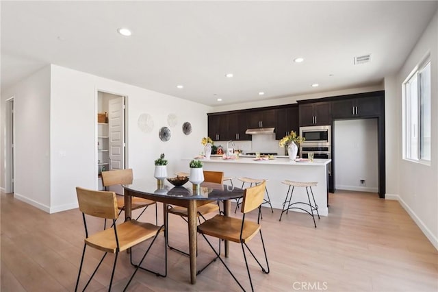 38840 Malva Rosa Dr, Palmdale, CA 93551 - dining area with light wood-style flooring and recessed lighting