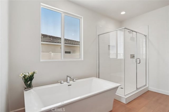 38840 Malva Rosa Dr, Palmdale, CA 93551 - full bathroom with a freestanding bath, a shower stall, wood finished floors, and recessed lighting