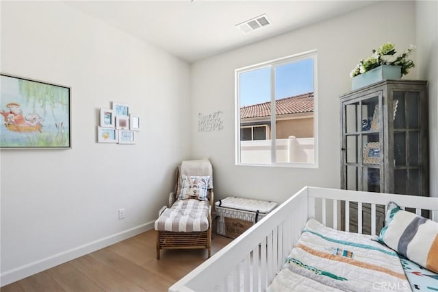 38840 Malva Rosa Dr, Palmdale, CA 93551 - bedroom featuring wood finished floors and baseboards