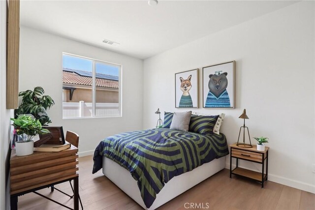 38840 Malva Rosa Dr, Palmdale, CA 93551 - bedroom featuring wood finished floors