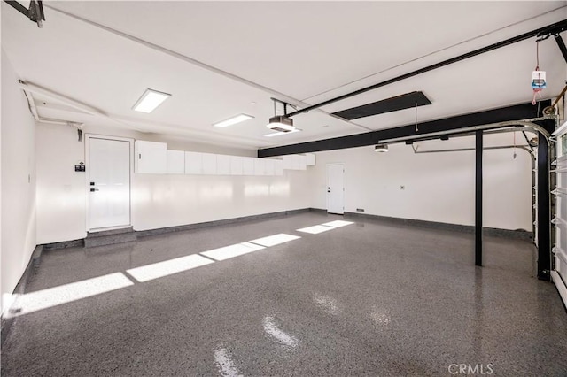 26592 Tampico Pl, Mission Viejo, CA 92691 - garage featuring a garage door opener and baseboards