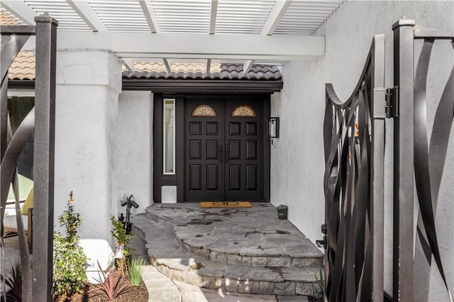 26592 Tampico Pl, Mission Viejo, CA 92691 - view of exterior entry featuring stucco siding, a tile roof, and a pergola