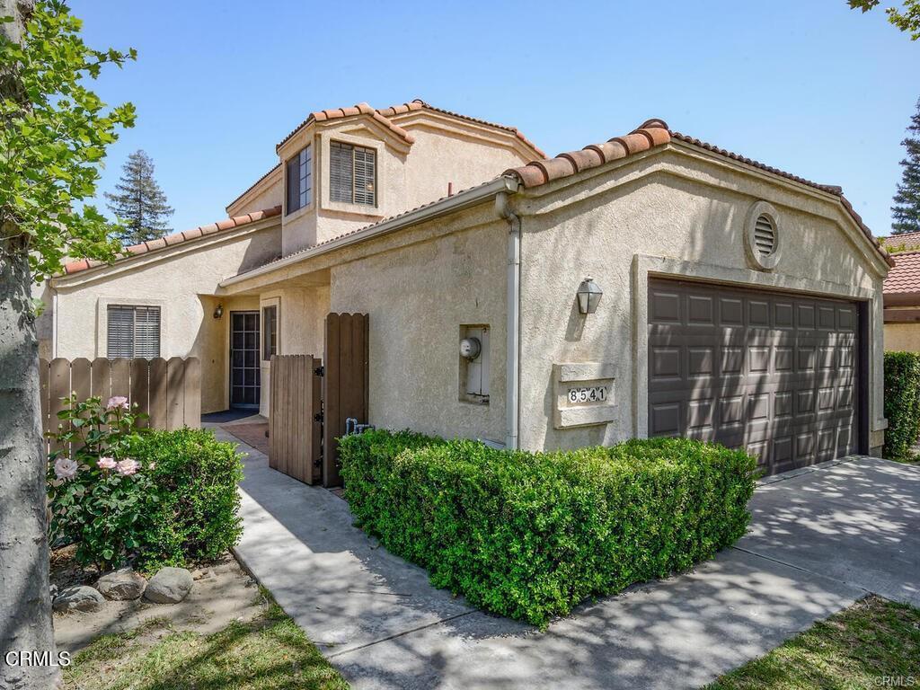 8541 Creekside Pl, Rancho Cucamonga, CA 91730 - view of front of property featuring stucco siding, a tiled roof, and a garage
