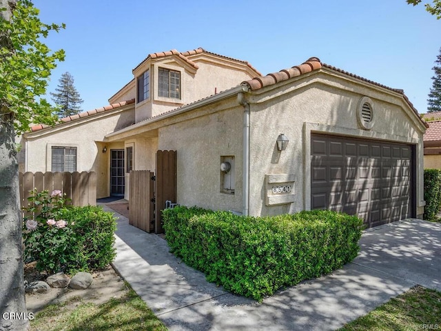 8541 Creekside Pl, Rancho Cucamonga, CA 91730 - view of front of property featuring stucco siding, a tiled roof, and a garage