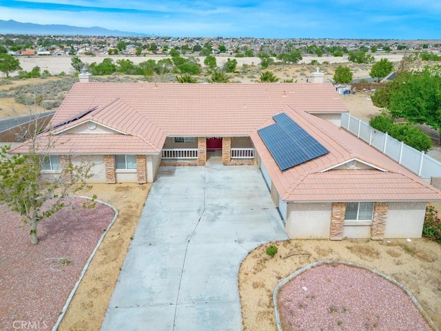13436 Havasu Rd, Apple Valley, CA 92308 - view of front of home featuring a tiled roof, stone siding, and solar panels