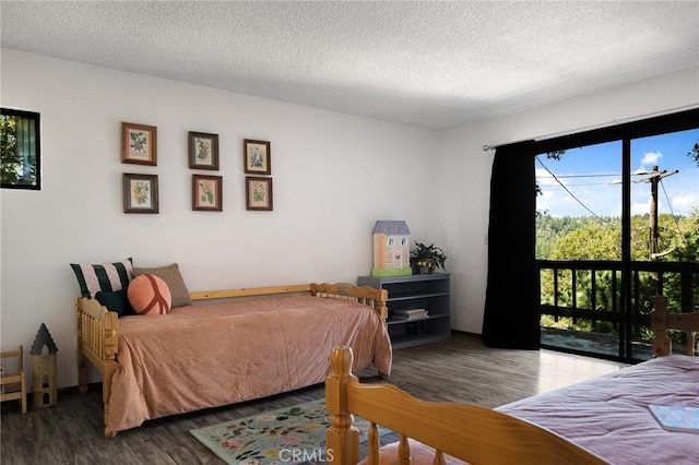 161 Pine Ridge Rd, Crestline, CA 92325 - bedroom featuring wood finished floors and a textured ceiling
