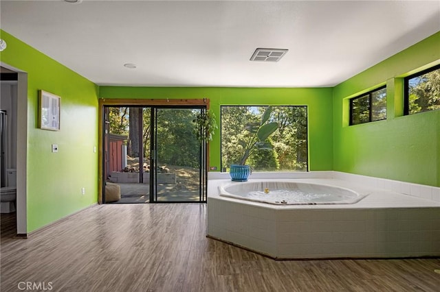 161 Pine Ridge Rd, Crestline, CA 92325 - full bathroom with a bath, wood finished floors, and plenty of natural light