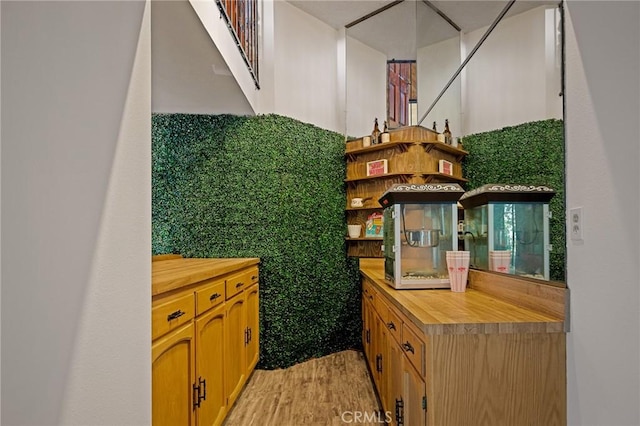 161 Pine Ridge Rd, Crestline, CA 92325 - kitchen with open shelves, light wood-style flooring, and butcher block counters