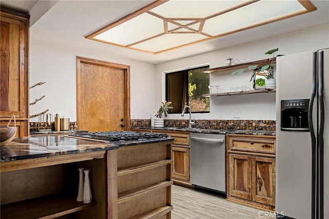 161 Pine Ridge Rd, Crestline, CA 92325 - kitchen with stainless steel appliances, open shelves, dark stone countertops, and brown cabinets
