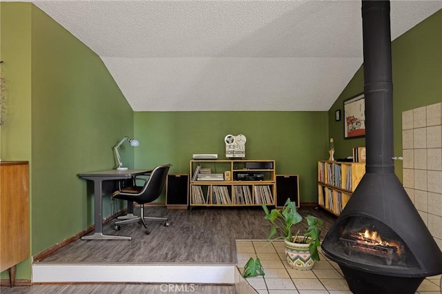 161 Pine Ridge Rd, Crestline, CA 92325 - office space featuring a wood stove, lofted ceiling, a textured ceiling, and wood finished floors