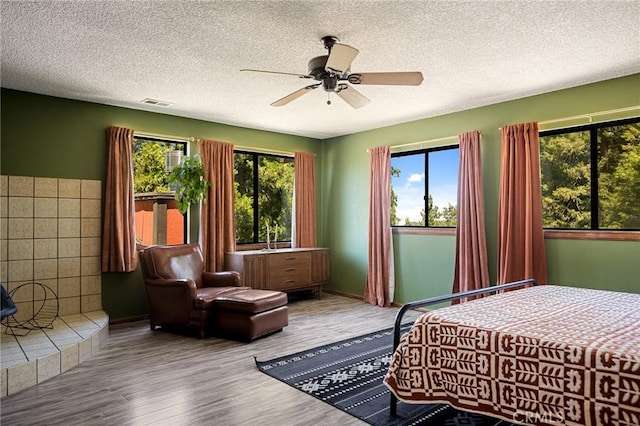161 Pine Ridge Rd, Crestline, CA 92325 - bedroom with wood finished floors, a textured ceiling, and a ceiling fan