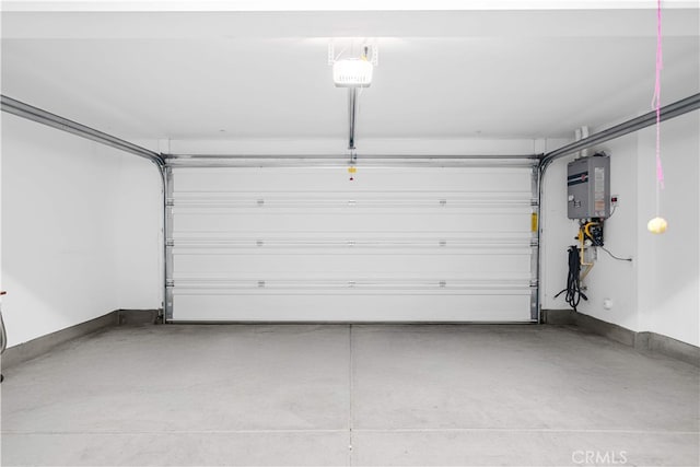 20916 Jade Dr, Walnut, CA 91789 - garage featuring a garage door opener and baseboards