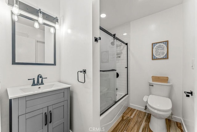 1745 Neil Armstrong Ave Unit 104, Montebello, CA 90640 - bathroom with wood finished floors, vanity, combined bath / shower with glass door, and recessed lighting