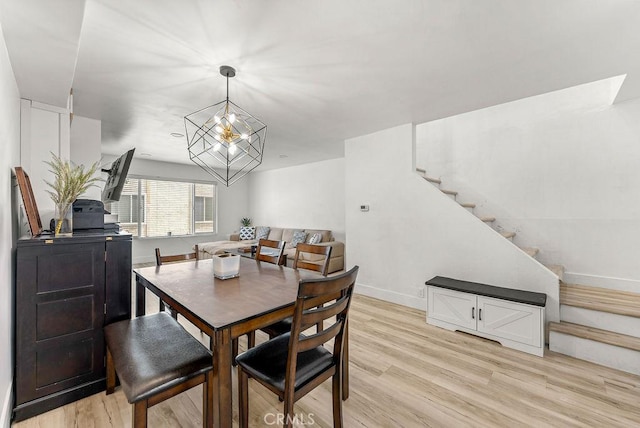 1745 Neil Armstrong Ave Unit 104, Montebello, CA 90640 - dining area with stairs and light wood-style floors