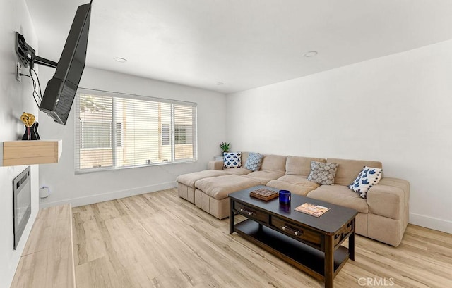 1745 Neil Armstrong Ave Unit 104, Montebello, CA 90640 - living area with baseboards and light wood finished floors