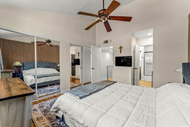 1745 Neil Armstrong Ave Unit 104, Montebello, CA 90640 - bedroom featuring multiple closets, wood finished floors, a high ceiling, and ceiling fan