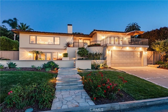 869 Rincon Ln, Palos Verdes Estates, CA 90274 - mediterranean / spanish home with a balcony, stucco siding, a chimney, driveway, and a garage