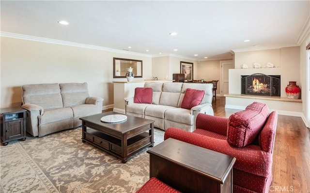 869 Rincon Ln, Palos Verdes Estates, CA 90274 - living area with recessed lighting, wood finished floors, a lit fireplace, and crown molding