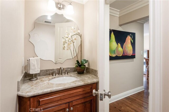 869 Rincon Ln, Palos Verdes Estates, CA 90274 - bathroom featuring vanity, ornamental molding, and wood finished floors