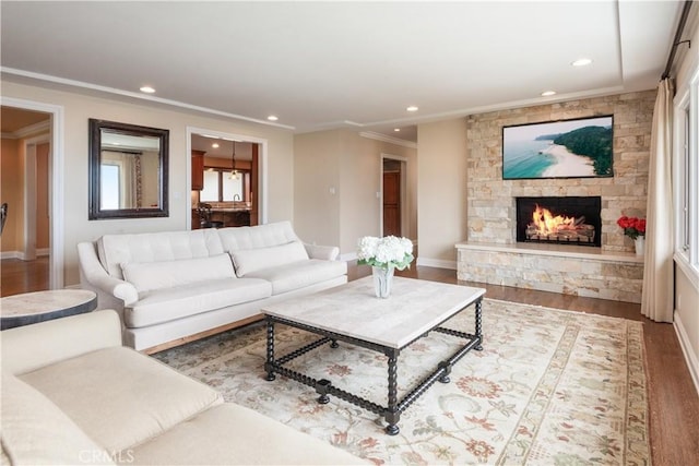 869 Rincon Ln, Palos Verdes Estates, CA 90274 - living area with wood finished floors, crown molding, a stone fireplace, and recessed lighting