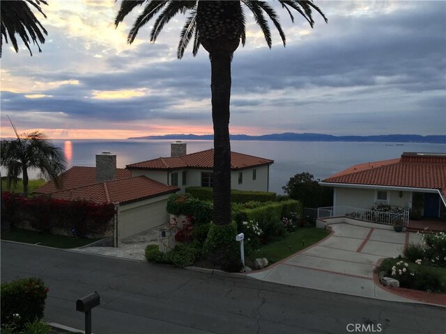 869 Rincon Ln, Palos Verdes Estates, CA 90274 - view of front of home with a tiled roof, a chimney, stucco siding, and a garage