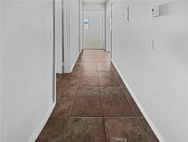 8800 Cedros Ave Unit 209, Panorama City, CA 91402 - hallway with baseboards and tile patterned floors