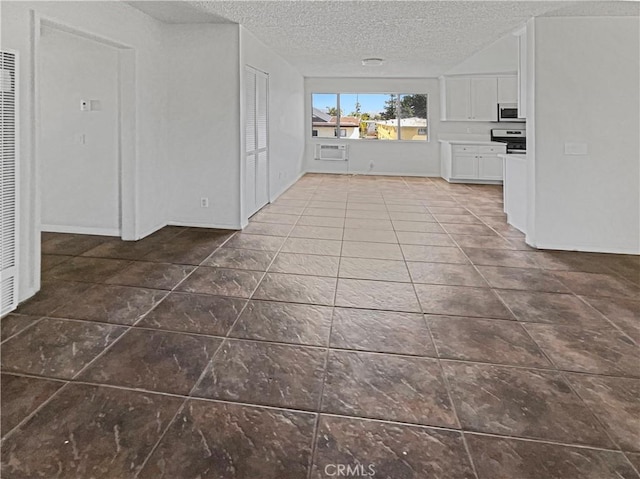 8800 Cedros Ave Unit 209, Panorama City, CA 91402 - unfurnished living room featuring a textured ceiling, tile patterned flooring, a wall mounted AC, and a heating unit